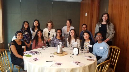 Alumni pose with scholarship recipients