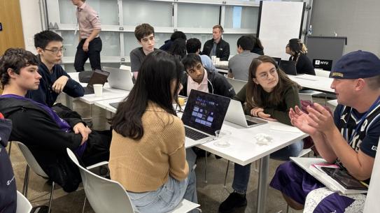 Students sitting aroud the table during the 2023 hAQathon