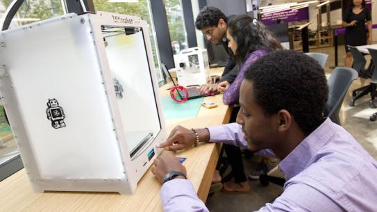 A student using a 3D printer