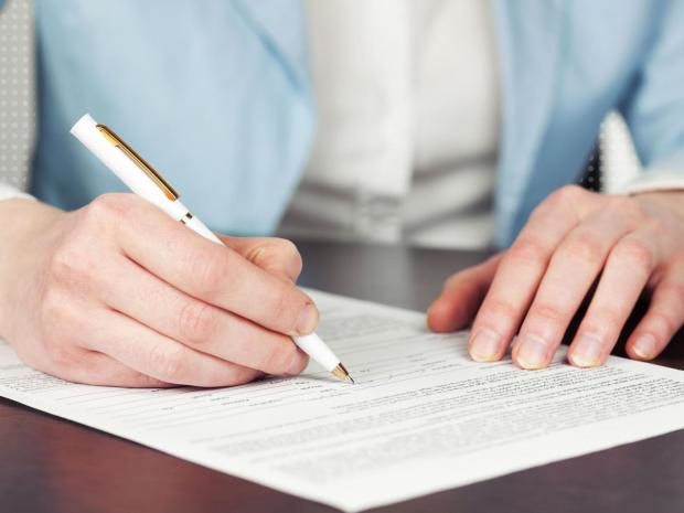 person filling out form person filling out form