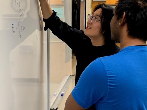 Photo of a tutor working with a student