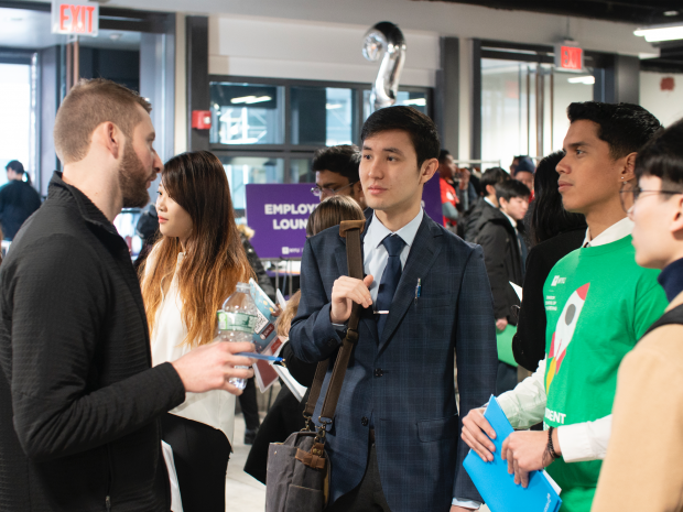 Students speaking to employers at our career fair