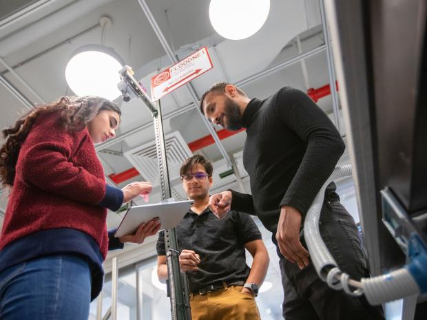 3 students working in lab