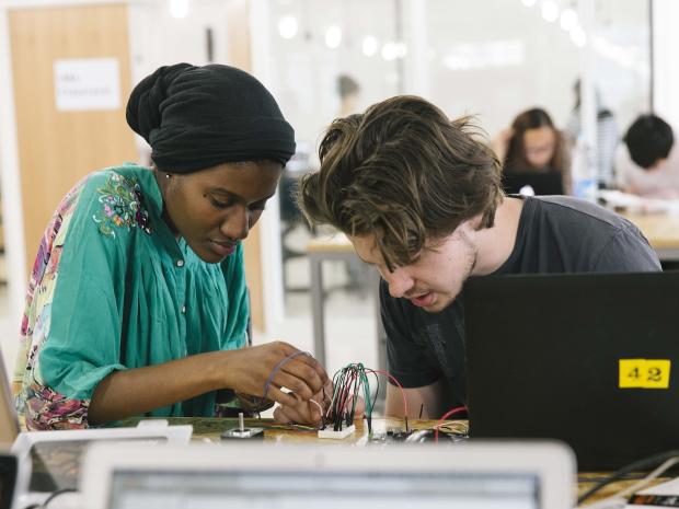 2 students working together on electrical project