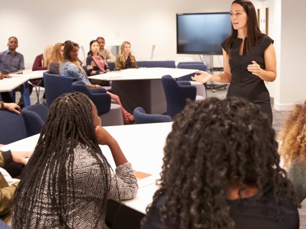 Students with professor in classroom