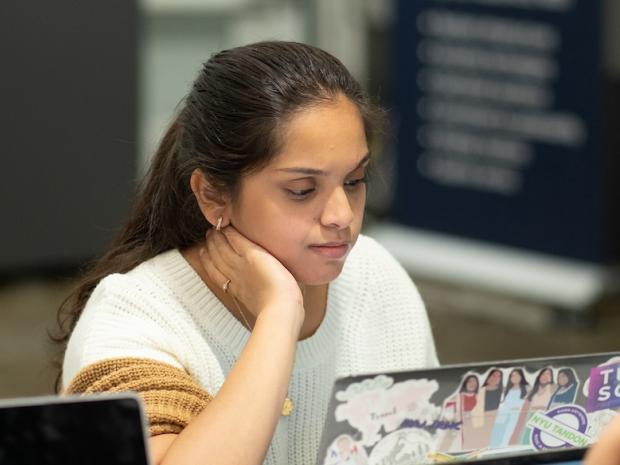 a female student looking at her laptop screen