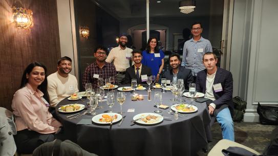 A group of alumni sitting at a table