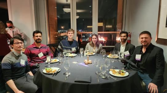 A group of alumni sitting at a table