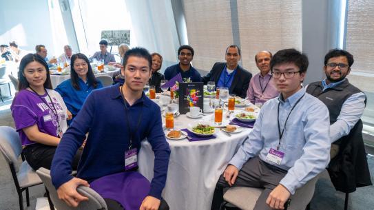 alumni and parents at table
