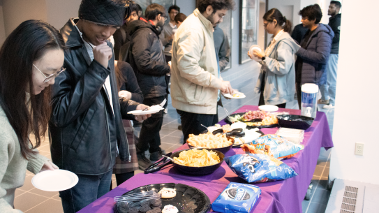 students serving themselves food at reception