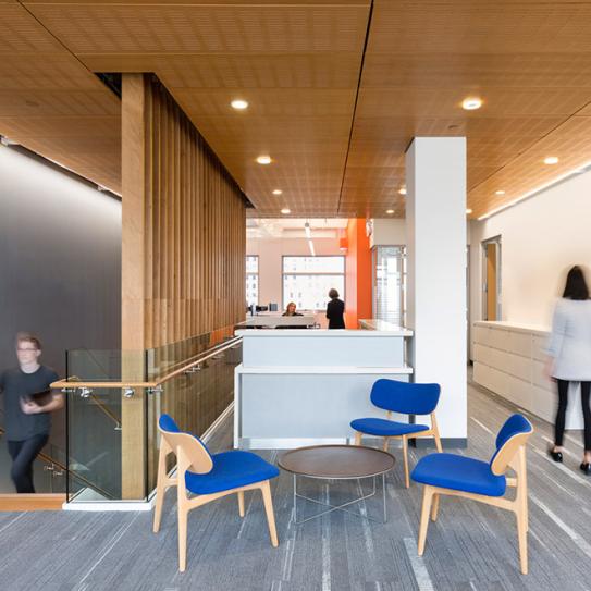 Students walk through open spaces on the 13th floor of 370 Jay Street.