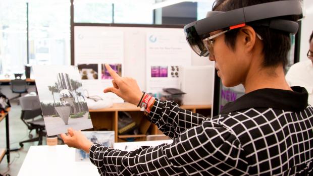 student wearing VR headset in AR/VR lab student wearing VR headset in AR/VR lab