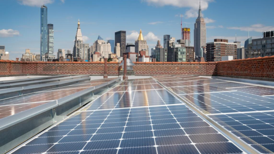 Solar panels in front of the New York City skyline