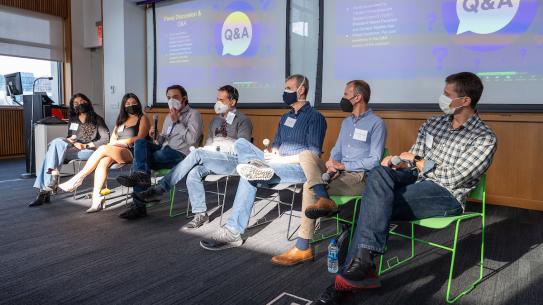 Panelists sitting in a line.