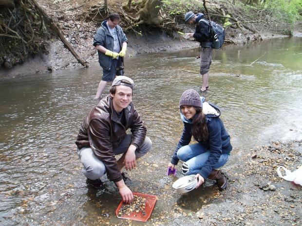 SUE students testing water quality in a creek SUE students testing water quality in a creek