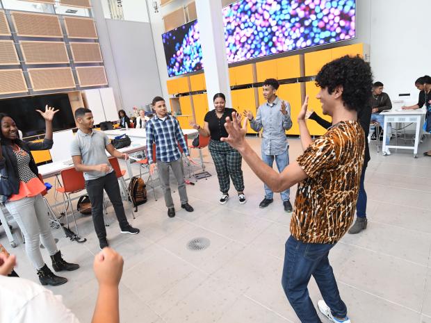 An instructor works with students on inprov exercises.