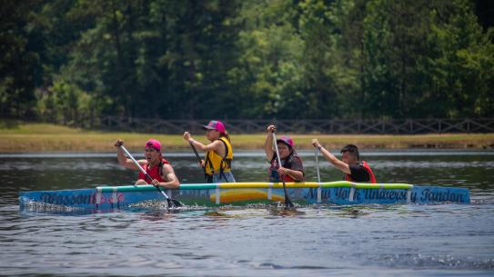 Image of co-ed team paddling
